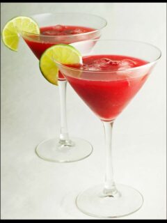Celebrate our second year blogiversary with two vibrant red martinis and lime wedges!
