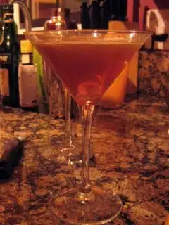 A Rob Roy martini sits on the counter top.