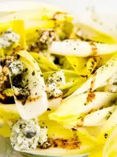 A plate of grilled fennel with blue cheese, perfect for a savory appetizer.
