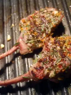 Grilled lamb chops seasoned with rosemary and thyme, then finished with a citrus crust.