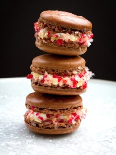 Three spicy hot chocolate macarons stacked on top of each other.