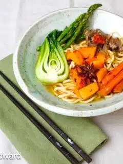This Lucky Beef Noodle Soup is filled with carrots and asparagus.